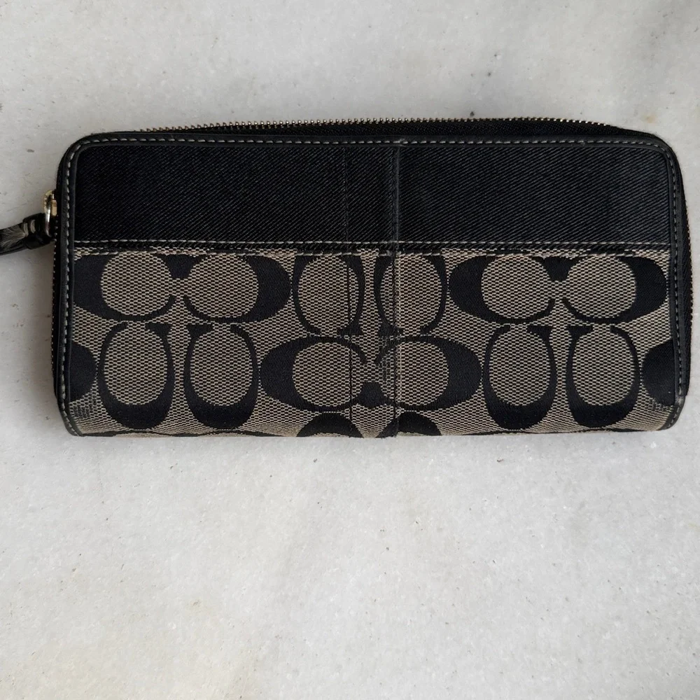 Coach Legacy Signature C jacquard and leather wallet.